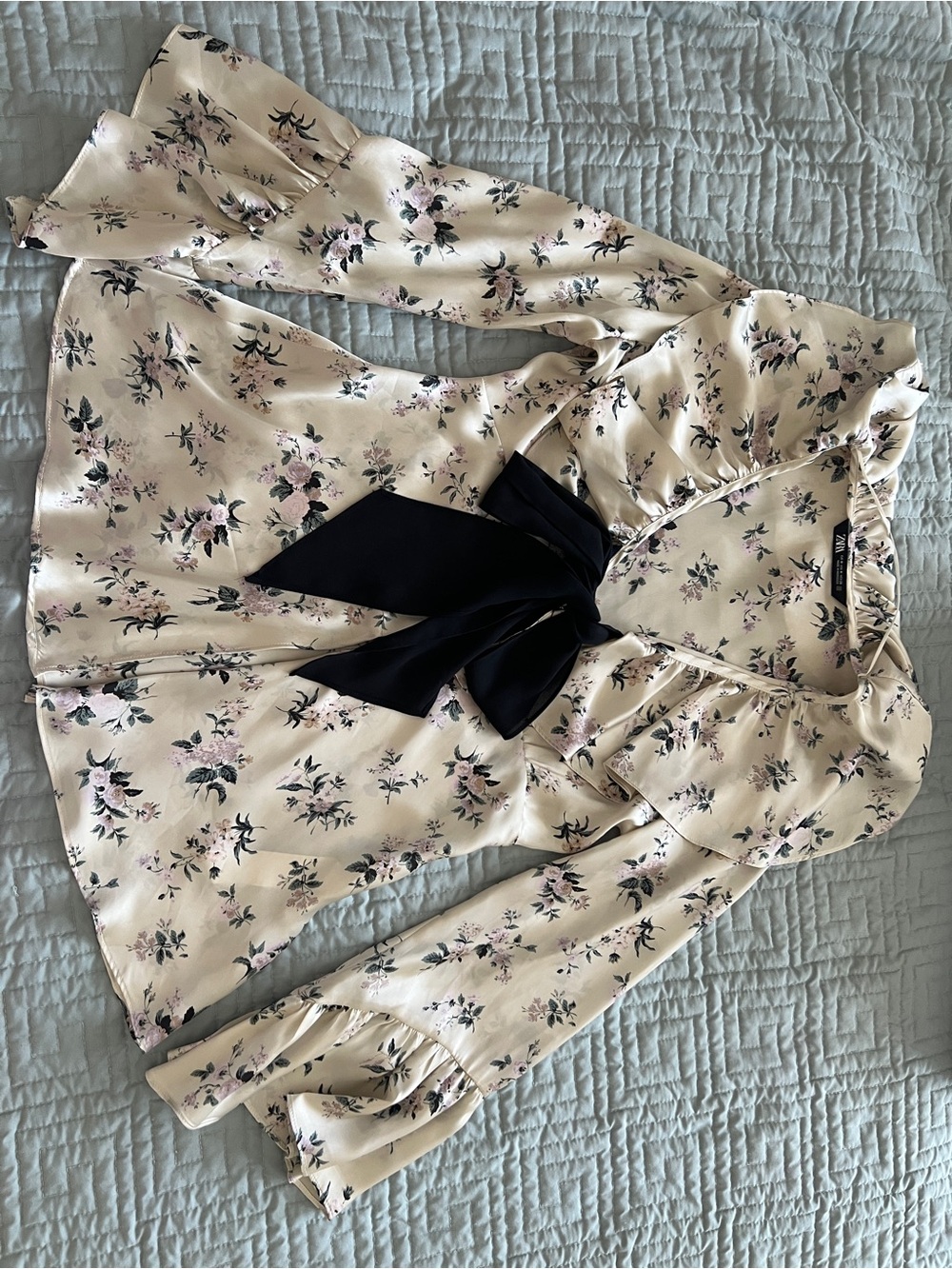 Zara Floral Ruffle Tie-Neck Blouse in Cream with Black Bow